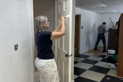 Mary Anne Sherman applying a fresh coat of paint