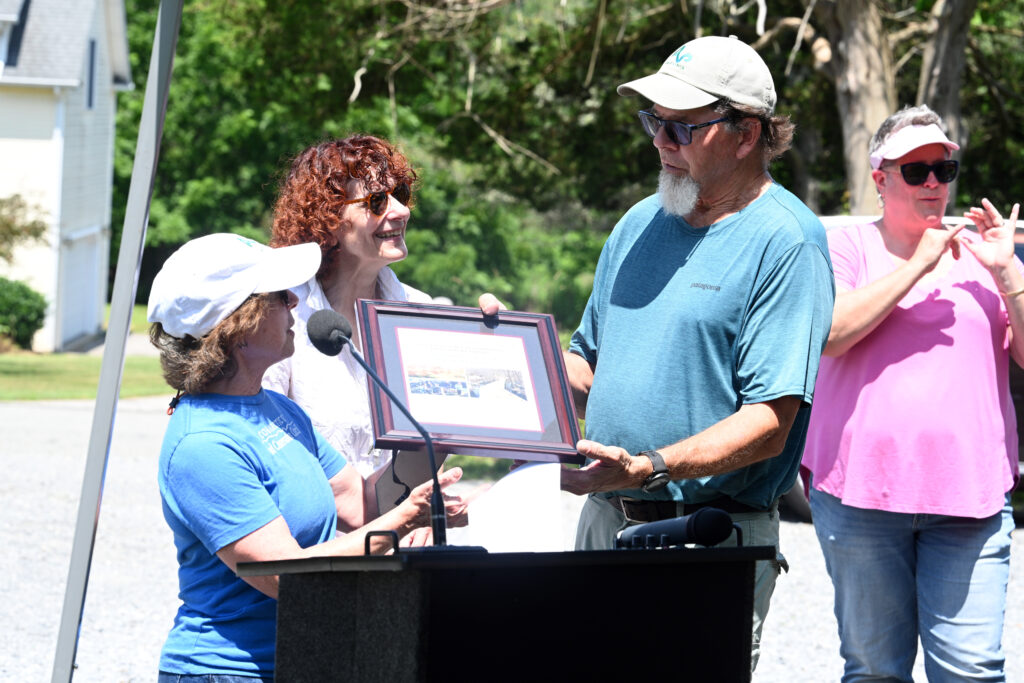 Dennis Main accepts award on Avalonia's behalf