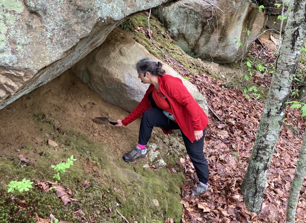Avalonia Land Conservancy - Mary digs silt for participants to touch
